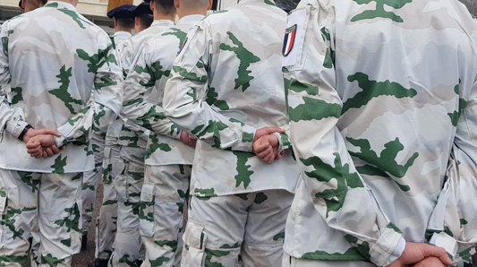 Group of soldiers wearing Tundra Alpine camouflage uniforms with green and white concealing coloration